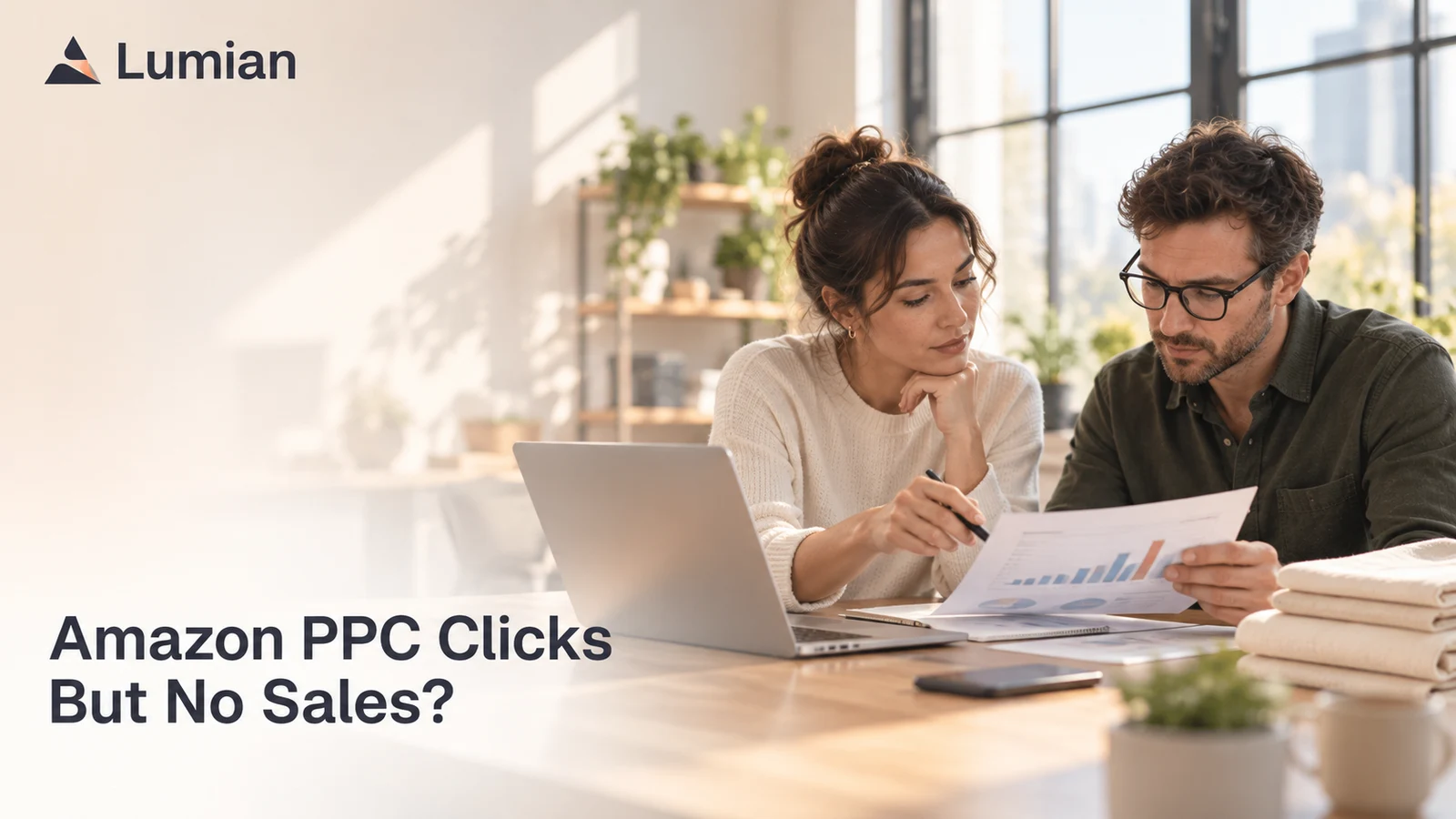 Two operators review an advertising report beside a laptop and folded napkins. Cover text: Amazon PPC Clicks But No Sales?